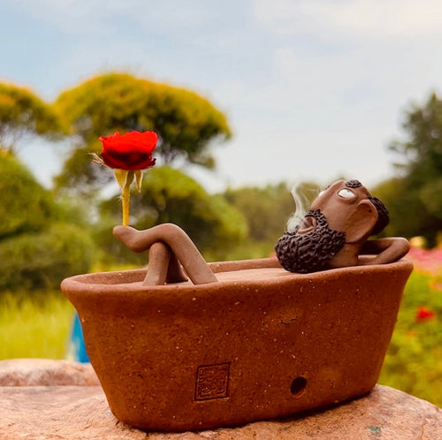 Classic Dharma bath incense burner with bareheaded figure